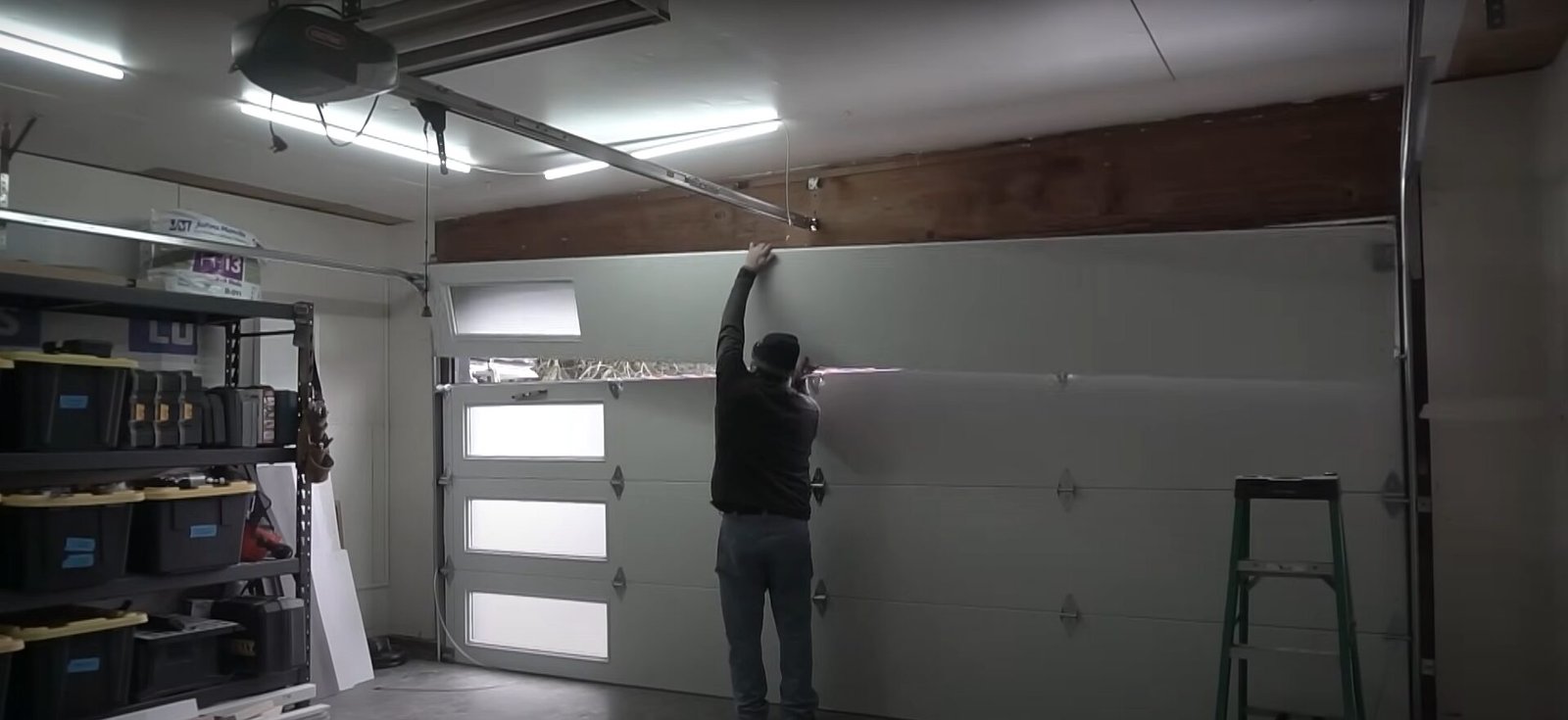 A modern insulated garage door being serviced by a technician from Element Garage Doors Repair LLC to improve energy efficiency.